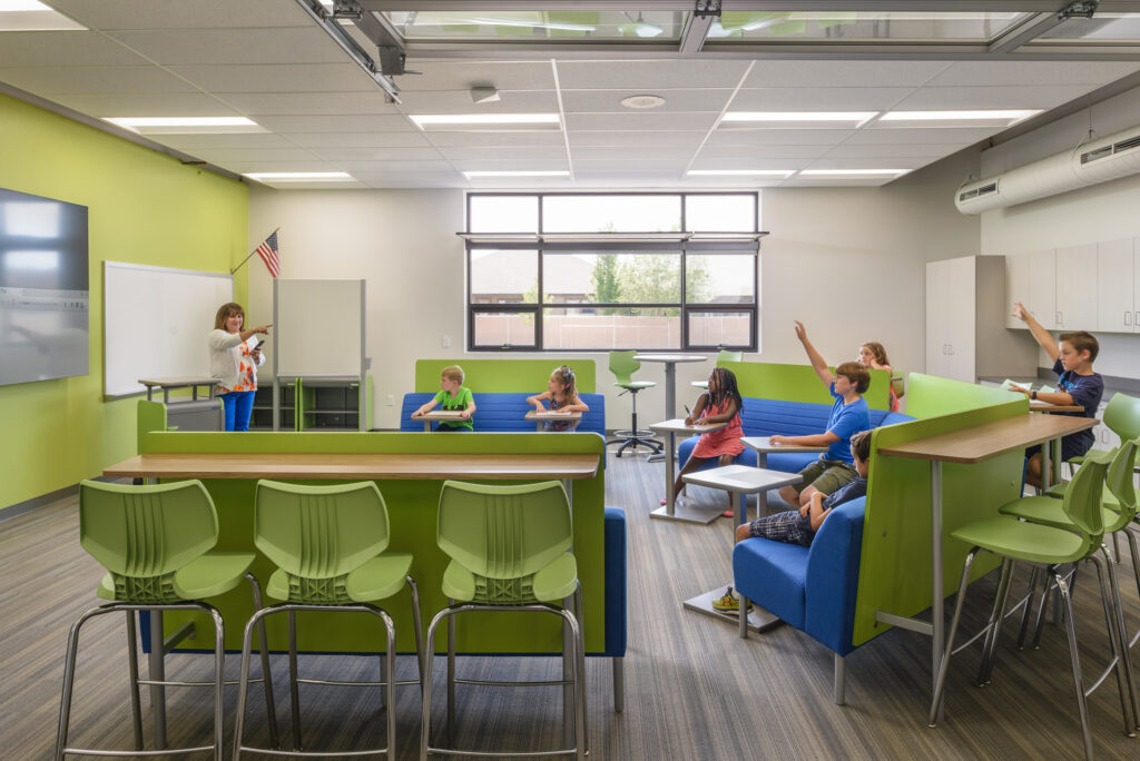 Students in a green and blue flexible classroom at St. Ignatius Catholic School