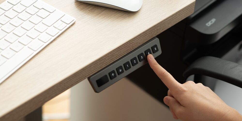 How Height-Adjustable Tech and Lighting Impact Long-Term Employee Health