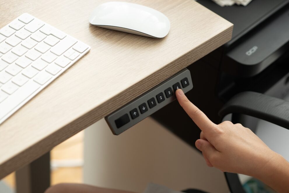 How Height-Adjustable Tech and Lighting Impact Long-Term Employee Health