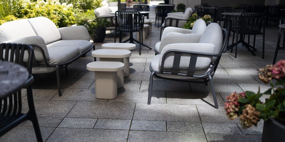 Stylish,Outdoor,Terrace,With,Contemporary,White,Lounge,Chairs,And,Tables, Prioritizing Commercial-Grade Durability: Choosing High-Quality Hospitality Furniture