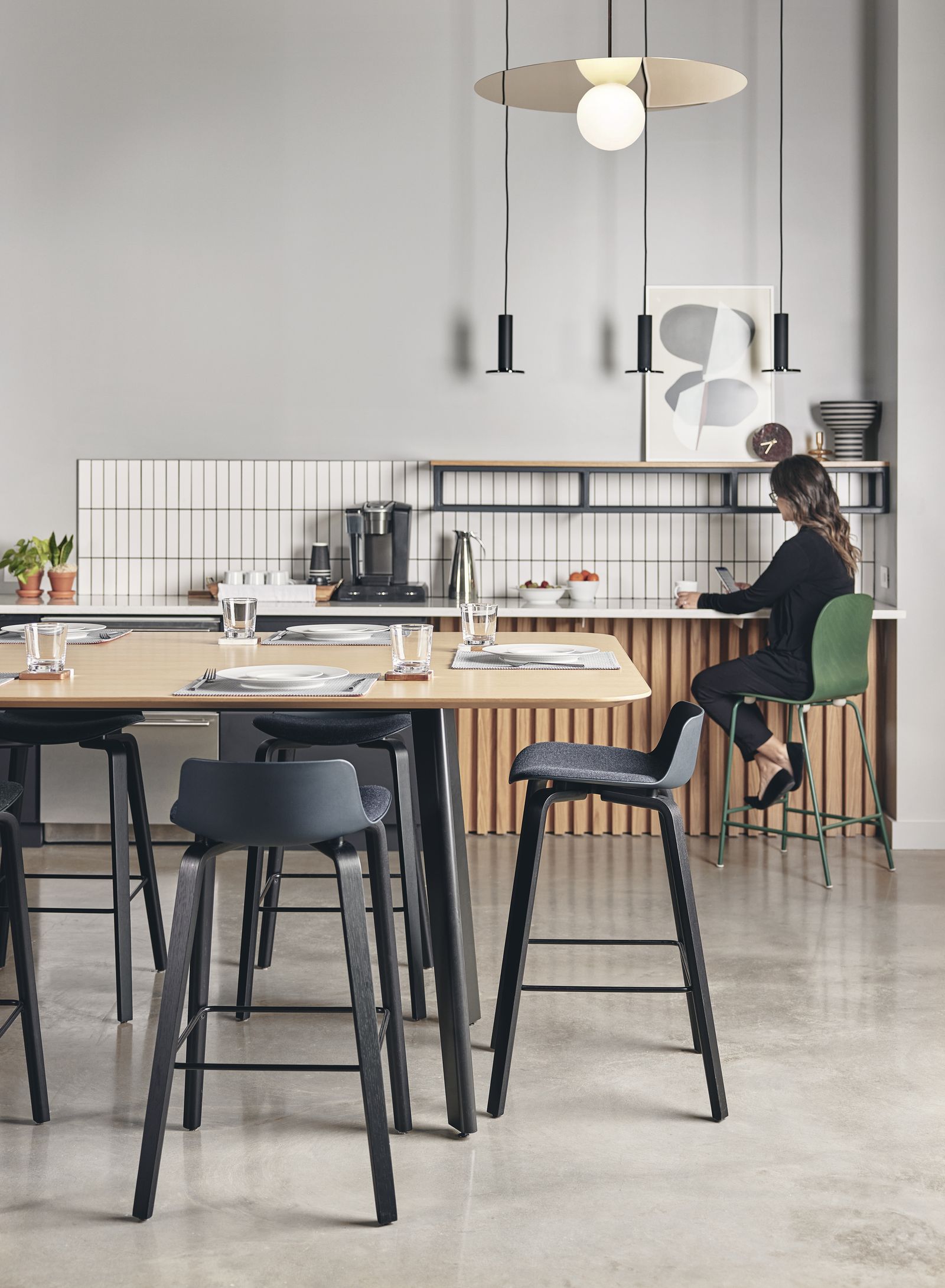 High cafe table in use beside a tiled service counter