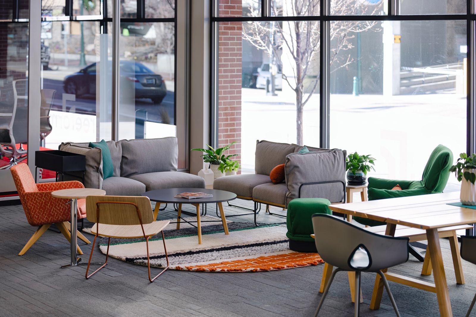 Colorful lounge grouping with mixed chairs and sofas in the showroom