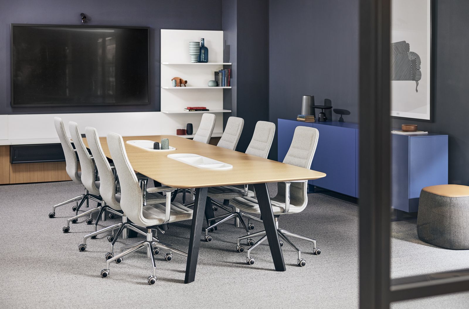 Conference room with oak table and white task chairs