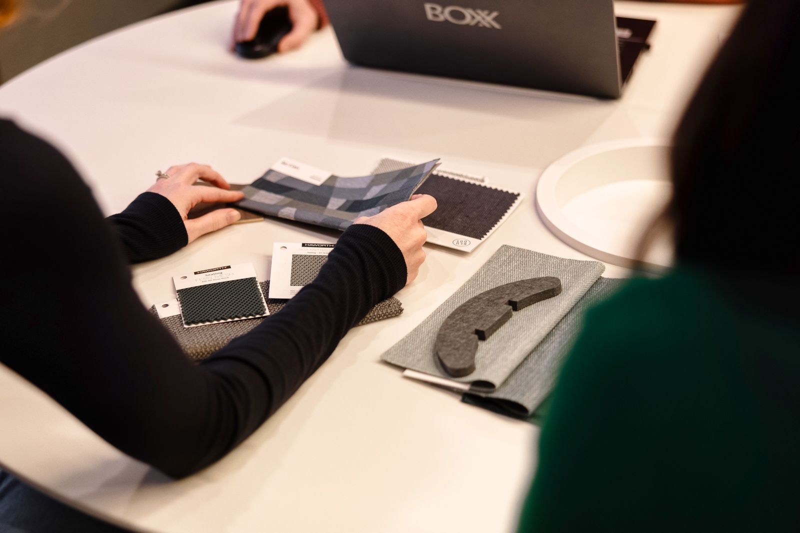 Finish and fabric samples laid out on a worktable