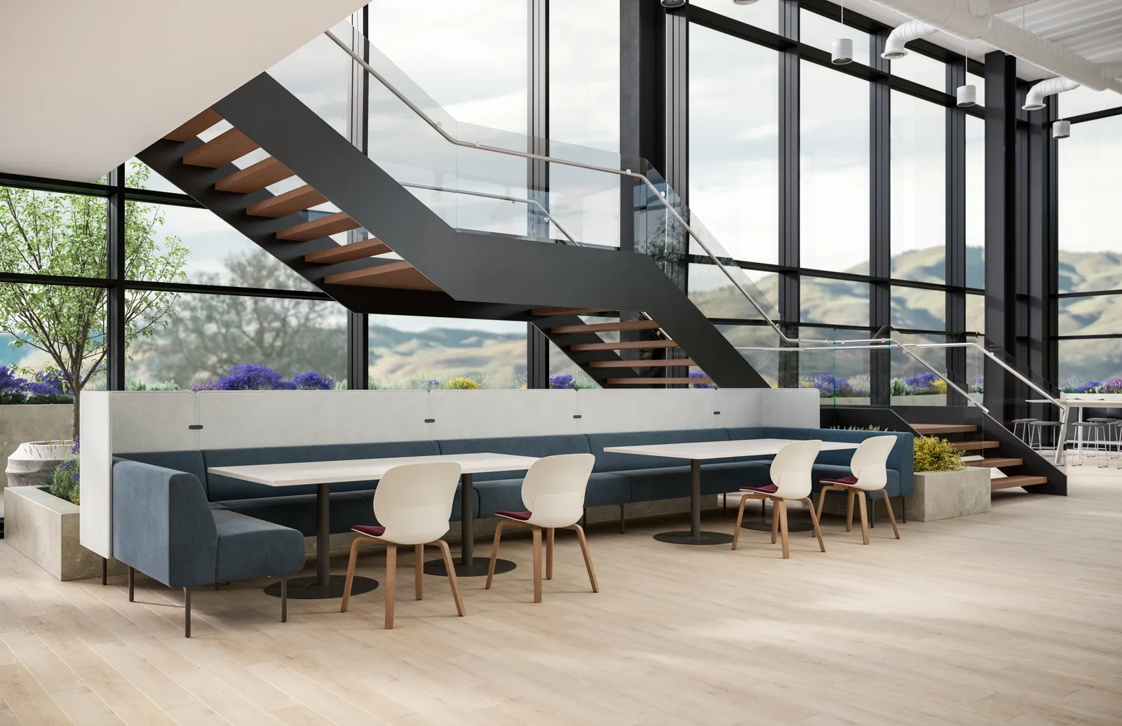 Haworth Moxie modular banquettes with tables in a bright atrium breakout space