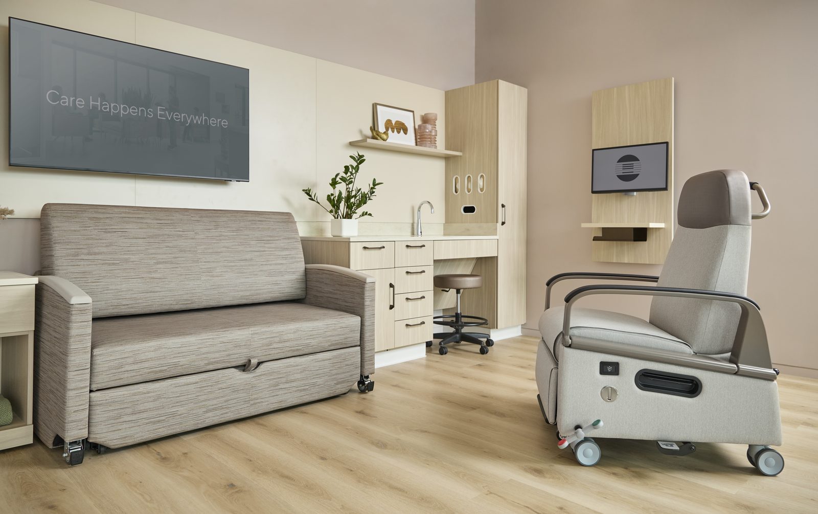 A patient room with a sleepover sofa, recliner, and coordinated casework