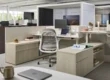 Open office with Haworth height-adjustable desks, Breck task chair, storage and acoustic pods