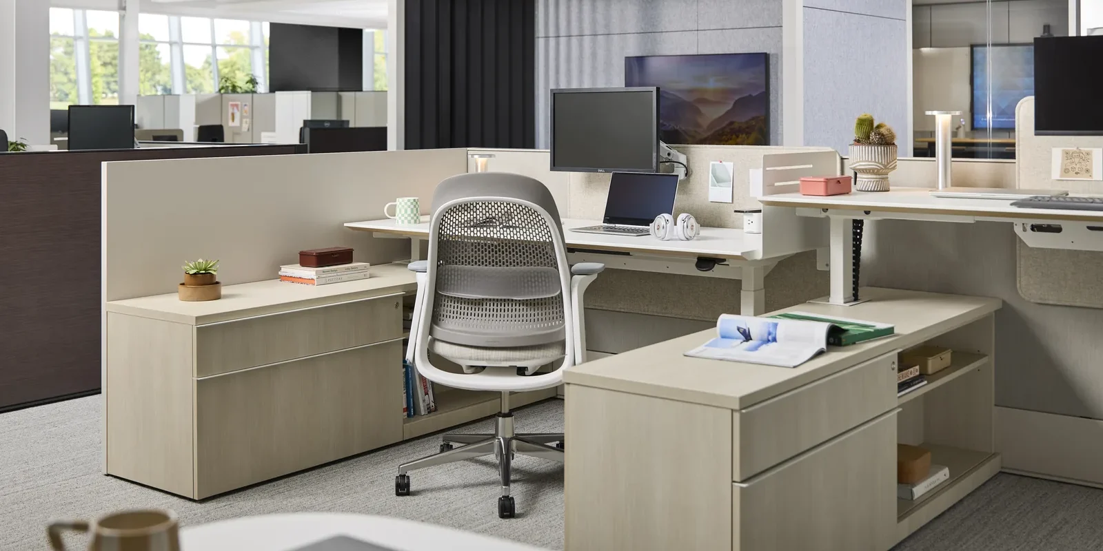 Open office with Haworth height-adjustable desks, Breck task chair, storage and acoustic pods