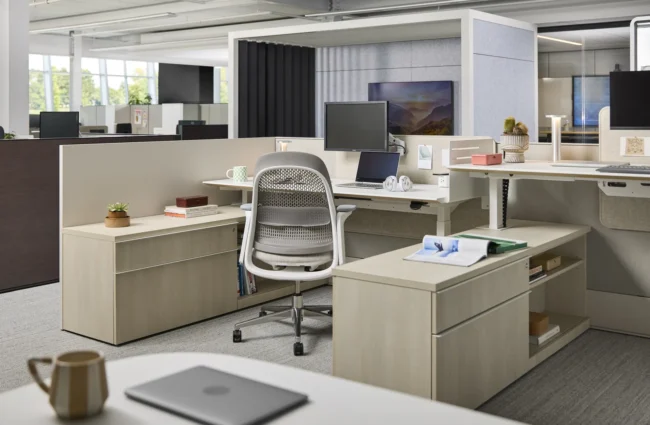 Open office with Haworth height-adjustable desks, Breck task chair, storage and acoustic pods