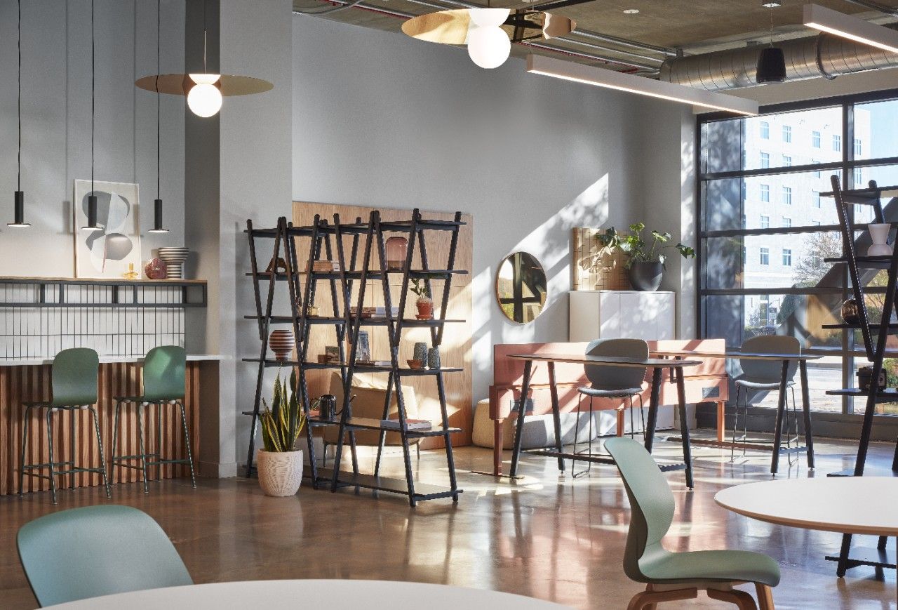Warm wood lounge with cafe seating and greenery